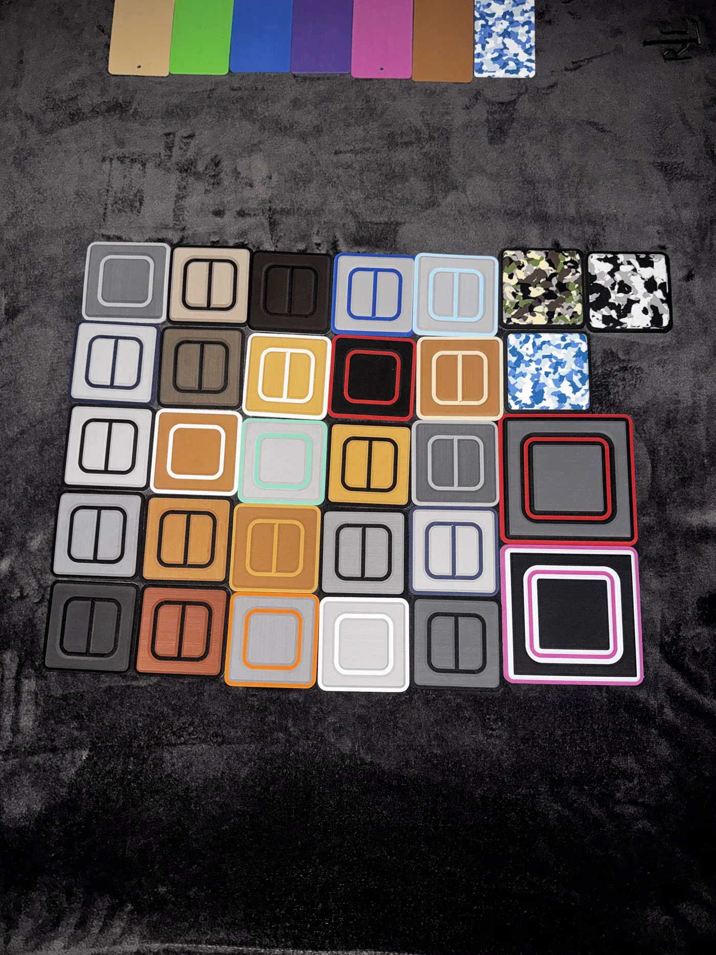 Routed two-colour foam sample boards laid out on dark cloth