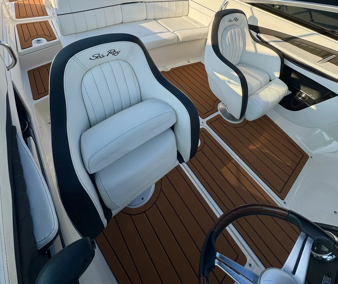 A finished faux teak cockpit floor seen from the helm
